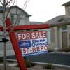 Photo: In this Feb. 8, 2008, file photo, a for-sale sign Photo: In this Feb. 8, 2008, file photo, a for-sale sign